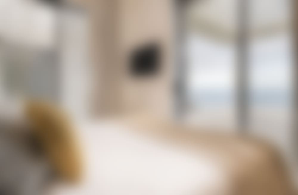 The same bedroom with its sea views and terrace access.